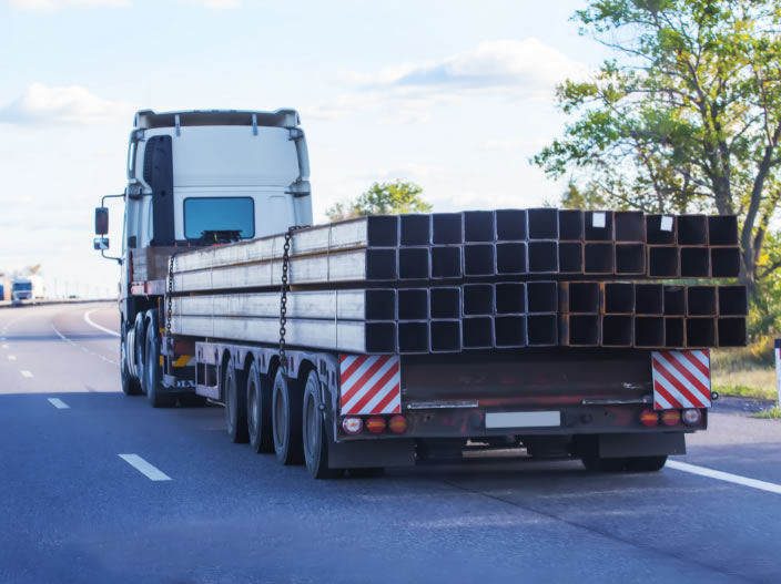 Metal columns on back of semi